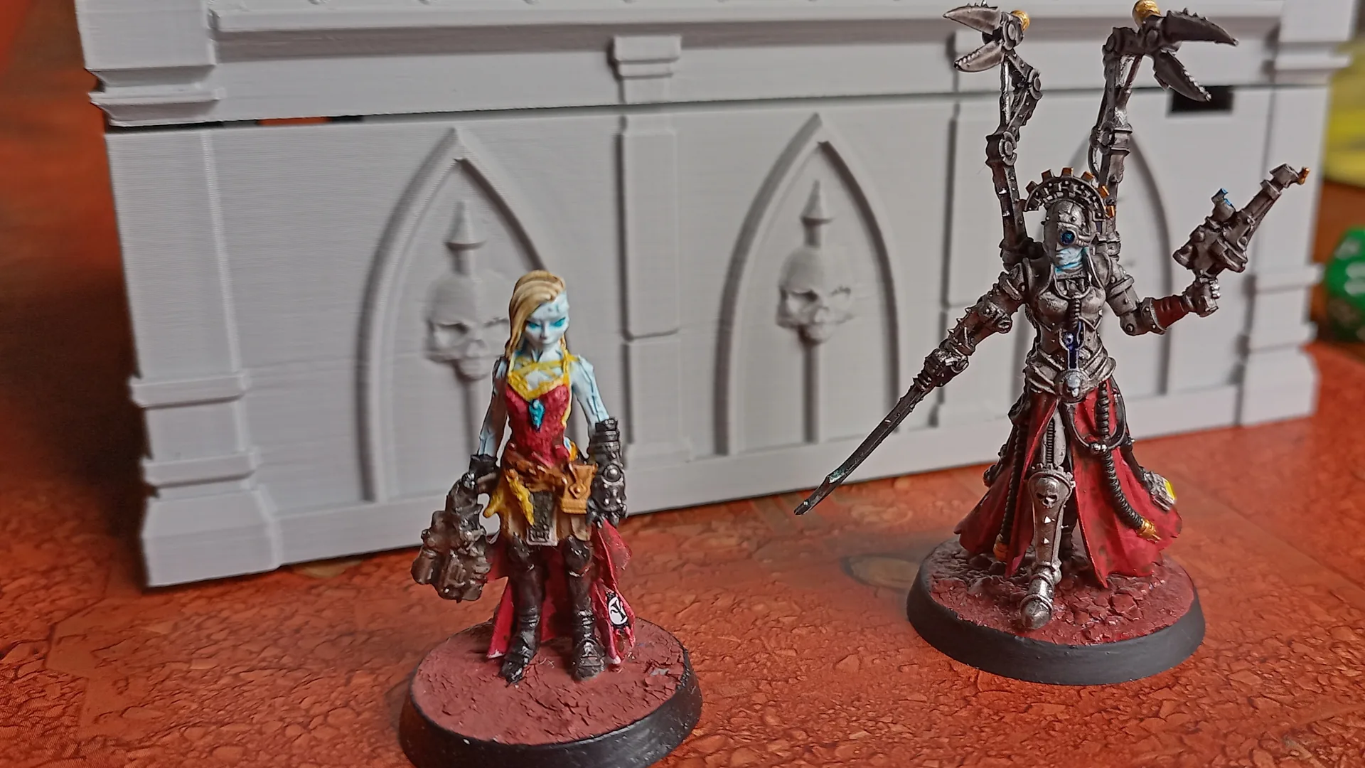 Mildly kitbashed Arcuitor Magisterium on the left, the official model on the right.